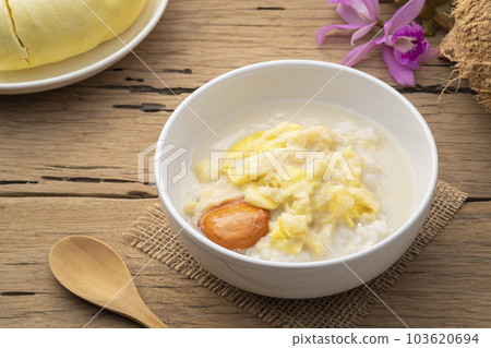 Thai sweet food,Cooked sticky rice in sweet coconut milk with Durian fruit in white bowl,popular dessert in Thailand 103620694