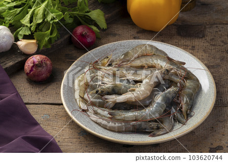 Close up Fresh raw shrimp (Litopenaeus vannamei) on grey plate Close up Fresh raw shrimp (Litopenaeus vannamei) on grey plate 103620744