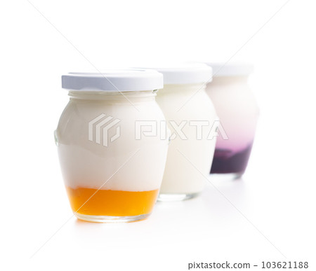 White and fruity yogurt in jar isolated on white background. White and fruity yogurt in jar isolated on white background. 103621188