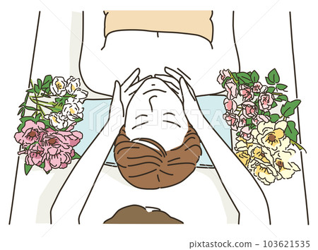 Young woman receiving treatment on a massage bed Young woman receiving treatment on a massage bed 103621535