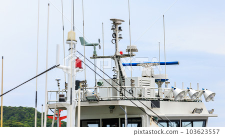 Antennas and navigation lights installed on the bridge of a fishing boat Antennas and navigation lights installed on the bridge of a fishing boat 103623557