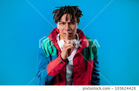 Handsome african man with gesture of shhh, secret, silence, conspiracy, gossip Handsome african man with gesture of shhh, secret, silence, conspiracy, gossip 103624428