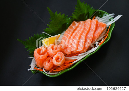 fresh raw salmon fish for cooking food seafood salmon fish, salmon sashimi food salmon fillet japanese menu with shiso perilla leaf lemon herb and spices 103624627