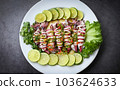 Steamed squid with lemon spicy chili and lemon sauce squid steamed with lime, Thai food seafood plate with herb and spices - top view 103624633