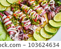 Steamed squid with lemon spicy chili and lemon sauce squid steamed with lime, Thai food seafood plate with herb and spices - top view 103624634