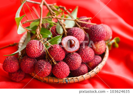fresh ripe lychee fruit tropical fruit peeled lychees slice in Thailand, lychees on basket 103624635