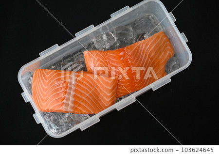 salmon fillet, fresh raw salmon fish on ice for cooking food seafood salmon fish in plastic box 103624645