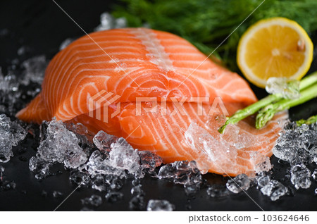 salmon fillet with lemon asparagus herb and spices, fresh raw salmon fish on ice for cooking food seafood salmon fish 103624646