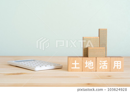 Image of land utilization | Wooden blocks, miniature buildings, calculators Image of land utilization | Wooden blocks, miniature buildings, calculators 103624928