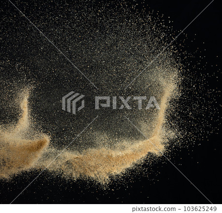 Sand flying explosion, Golden sand wave explode. Abstract sands cloud fly. Yellow colored sand splash throwing in Air. black background Isolated high speed shutter, throwing freeze stop motion Sand flying explosion, Golden sand wave explode. Abstract sands cloud fly. Yellow colored sand splash throwing in Air. black background Isolated high speed shutter, throwing freeze stop motion 103625249