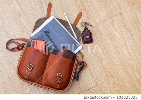 Hand made Genuine Leather Messenger Bag on the floor 103625323