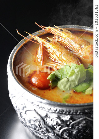Hot tom yum goong shot against a black background 103631363