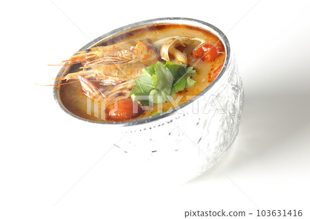 Hot tom yum goong shot against a white background Hot tom yum goong shot against a white background 103631416