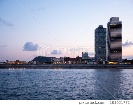Torre Mapfre and Hotel Arts in evening time 103631771