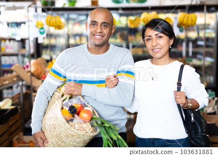 Family couple with bag of groceries with store Family couple with bag of groceries with store 103631881
