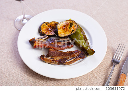 Delicious uruguayan style churrasco steak served with eggplant and pimento pepper 103631972