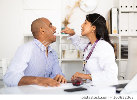 Patient in examination by doctor in clinic 103632362