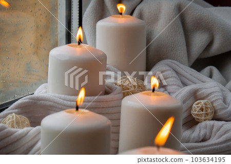 Home fragnance concept autumn holidays at cozy home on the windowsill Hygge aesthetic atmosphere on knitted white sweater. Still life of micro moment candid slow living. Mental health wellbeing Home fragnance concept autumn holidays at cozy home on the windowsill Hygge aesthetic atmosphere on knitted white sweater. Still life of micro moment candid slow living. Mental health wellbeing 103634195