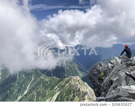 Climbers admiring the view from the summit of Mt. Yarigatake 103635827