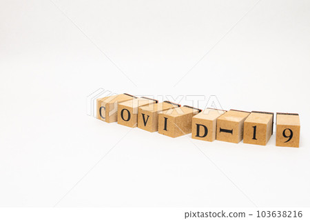 Wooden block English word COVID-19 103638216