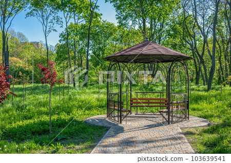 Alleys and gazebo in the Victory park in Odessa, Ukraine. Alleys and gazebo in the Victory park in Odessa, Ukraine. 103639541