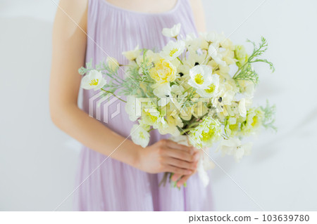 Woman with a bouquet 103639780