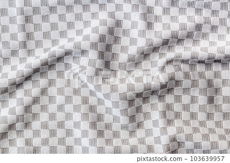 Texture of  the checkered kitchen napkin. Top view. Texture of  the checkered kitchen napkin. Top view. 103639957