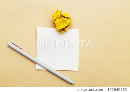 crumpled yelllow paper as concept creative idea and innovation. writing ideas, to do list concept. 103640283