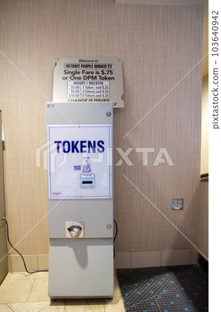 DETROIT, MICHIGAN, UNITED STATES - MAY 22nd, 2018: Detoit People Mover ticket machine. Get a token for the elevated monorail which is one of many public modes of transportation in the city DETROIT, MICHIGAN, UNITED STATES - MAY 22nd, 2018: Detoit People Mover ticket machine. Get a token for the elevated monorail which is one of many public modes of transportation in the city 103640942
