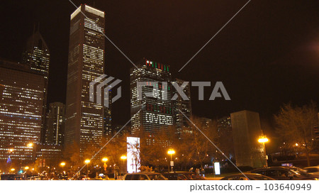 CHICAGO, ILLINOIS, UNITED STATES - DEC 12, 2015: Crown Fountain sculpture consisting of two 50-foot-tall LED towers and a reflecting pool during a winter night at Millennium Park in Downtown 103640949