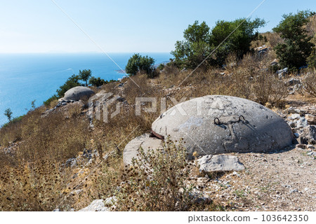 Surrounding Saranda, Albania, are hills topped with military bunkers guarding the high shore of the Ionian Sea 103642350