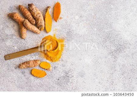Turmeric roots background Turmeric roots background 103643450