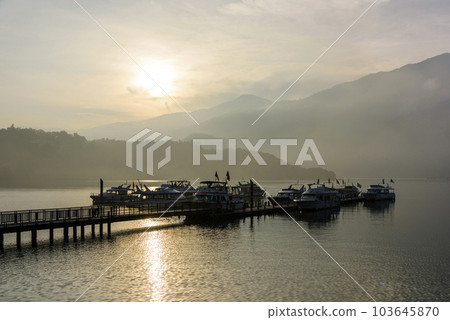 Sunrise view of yacht Marina in Sun Moon Lake, Nantou, Taiwan. it's a famous attraction in Taiwan. Sunrise view of yacht Marina in Sun Moon Lake, Nantou, Taiwan. it's a famous attraction in Taiwan. 103645870