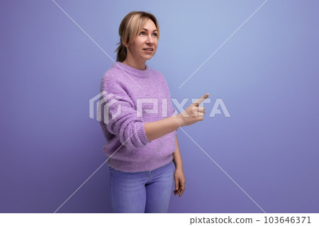 charming blond young millennial woman in casual look pointing finger at someone, scolding on bright charming blond young millennial woman in casual look pointing finger at someone, scolding on bright 103646371