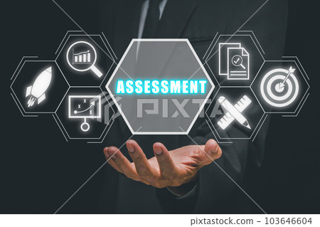 Assessment analysis Business analytics evaluation measure technology concept, Business person hand holding assessment icon on virtual screen. 103646604