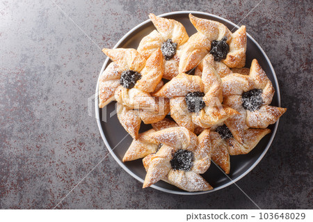 Joulutorttu are traditional Finnish jam tarts made and eaten at Christmas close-up in a plate. Horizontal top view 103648029