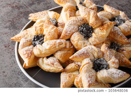 Joulutorttu aka Tahtitorttu are traditional Finnish Christmas Tarts that are specially eaten during Christmas and holiday season close-up in a plate. Horizontal 103648036