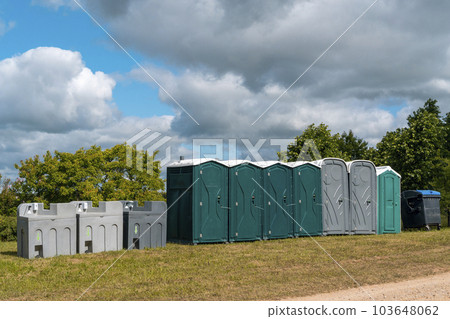 Portable mobile toilets and plastic hand washing sink stations on the public park Portable mobile toilets and plastic hand washing sink stations on the public park 103648062