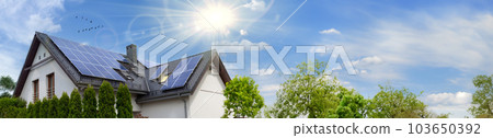 Modern house with solar panels. Clear sky, sun. Web banner, copy space. 103650392