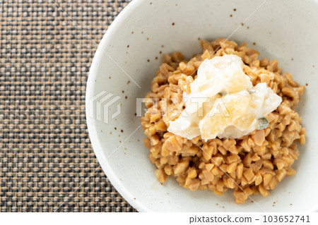 Natto. (Hikiwari natto with herring roe pickled in wasabi (Sankai pickled) topping). Natto. (Hikiwari natto with herring roe pickled in wasabi (Sankai pickled) topping). 103652741