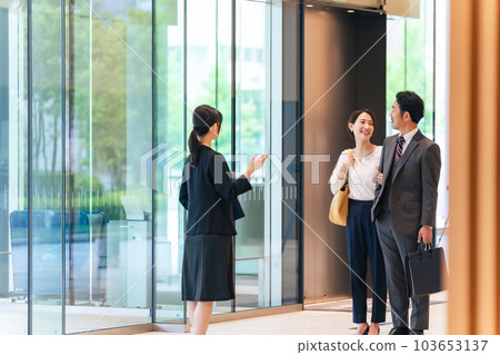 A female guide guiding a couple A female guide guiding a couple 103653137