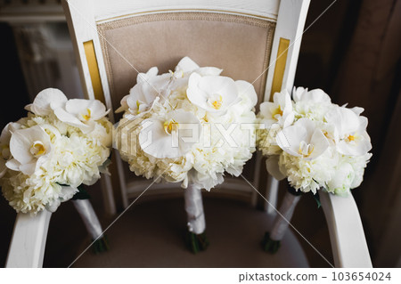 Beautiful wedding bouquet with different flowers, roses Beautiful wedding bouquet with different flowers, roses 103654024