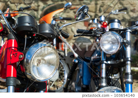 Retro motorcycles parked on the street 103654140