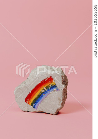 rock with a rainbow flag painted on it rock with a rainbow flag painted on it 103655659