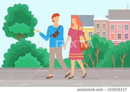 Couple walking in the city park. Cute happy smiling girl and guy on date are communicating 103656317