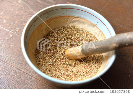 Ground sesame in a mortar Ground sesame in a mortar 103657868