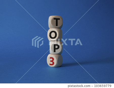 Top 3 symbol. Concept word Top 3 on wooden cubes. Beautiful blue background. Business and Top 3 concept. Copy space. 103659779