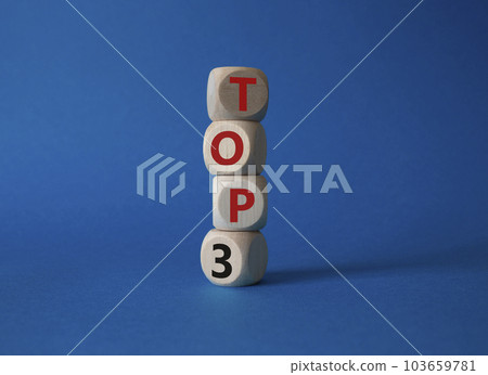 Top 3 symbol. Concept word Top 3 on wooden cubes. Beautiful blue background. Business and Top 3 concept. Copy space. Top 3 symbol. Concept word Top 3 on wooden cubes. Beautiful blue background. Business and Top 3 concept. Copy space. 103659781