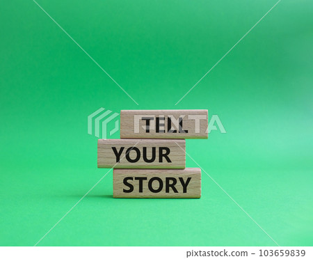 Tell your story symbol. Wooden blocks with words Tell your story. Beautiful green background. Business and Tell your story concept. Copy space. Tell your story symbol. Wooden blocks with words Tell your story. Beautiful green background. Business and Tell your story concept. Copy space. 103659839