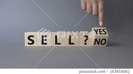 Sell Yes or No symbol. Businessman Hand points at wooden cubes with words Sell No or Sell Yes. Beautiful grey background. Business and Sell concept. Copy space 103659862